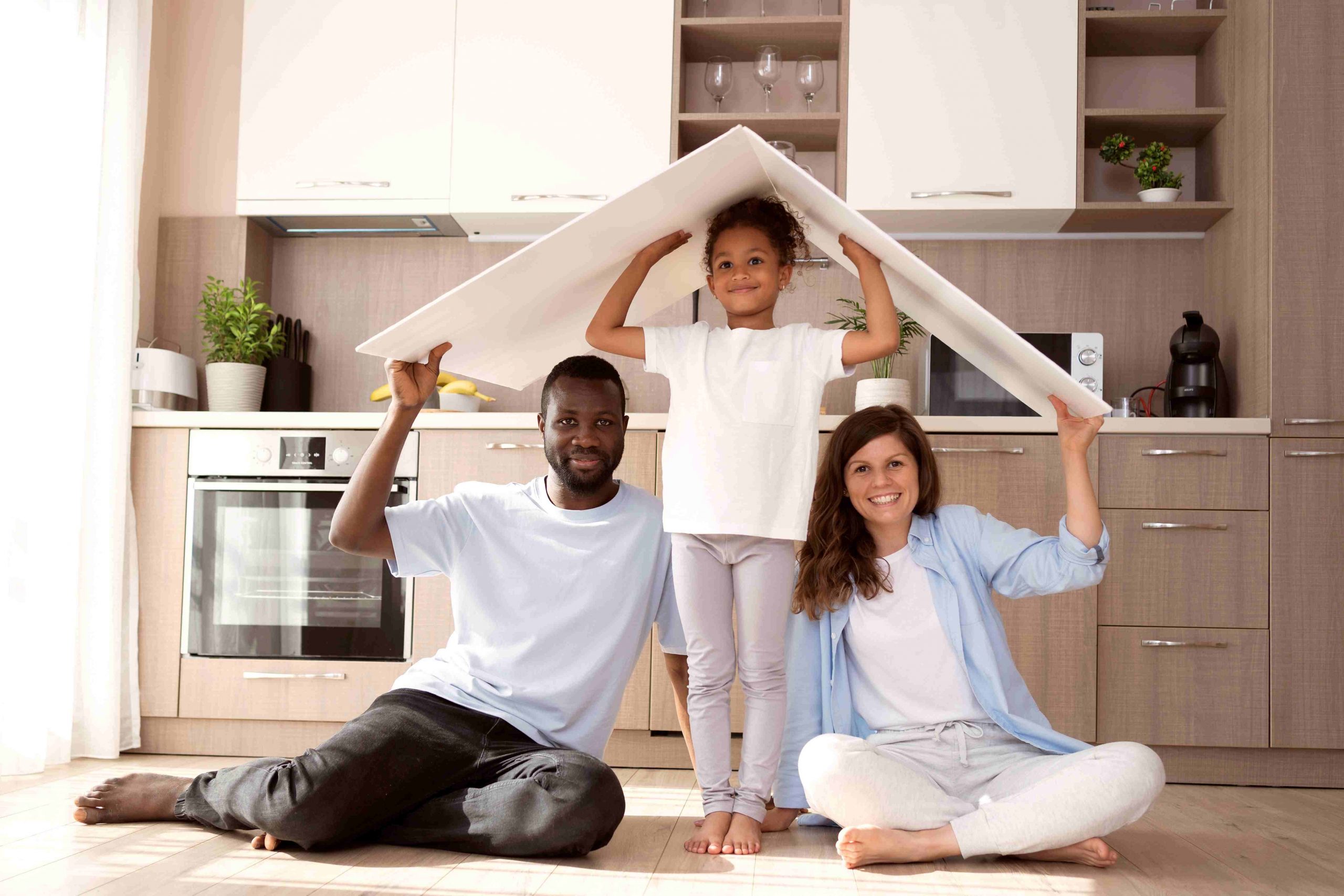 cute-family-holding-roof-their-head